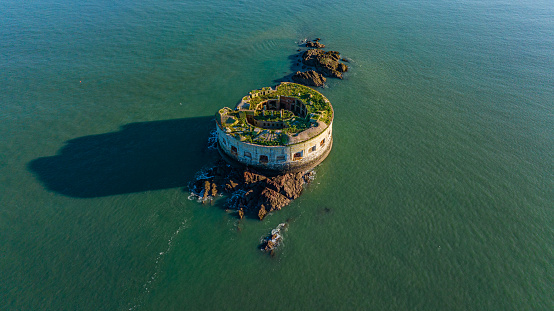 Aerial photo from a drone of Stack Rock Fort, a small fort built on an island in the Milford Haven Waterway, Pembrokeshire, Wales, UK.