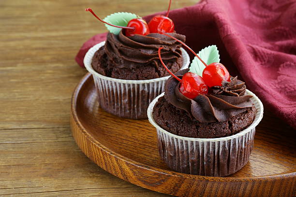 istock cupcake with chocolate ganache  and cherries 182114580