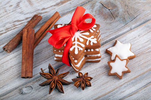 Christmas gingerbread cookie stars on wooden table.