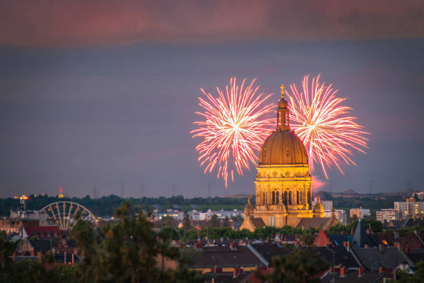 Fireworks in Mainz, Germany behind silhouette of Christuskirche (Christ church)
