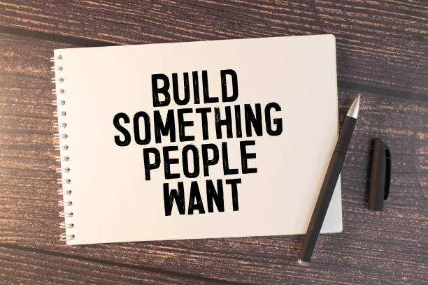 istock Build something people want. text on white notepad on craft background 1821188010