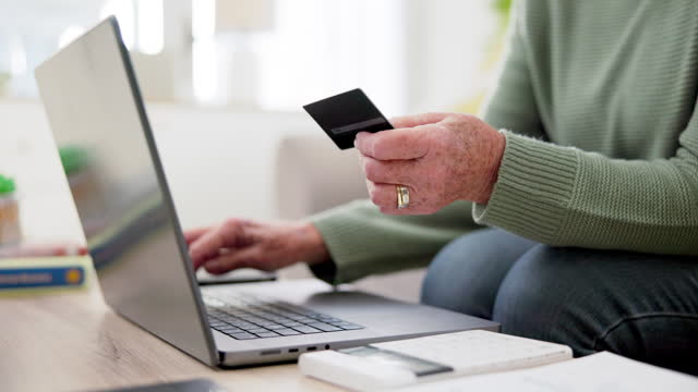 Woman hands, credit card and laptop in online shopping, home investment and banking or pension funding on sofa. Senior or elderly person typing on computer for payment plan, e commerce or transaction