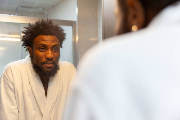 istock Portrait of afro men looking mirror 1821263791