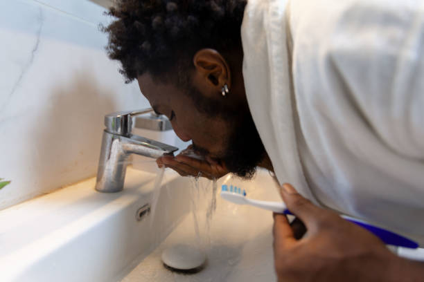 istock Afro men is cleaning mouth 1821265391