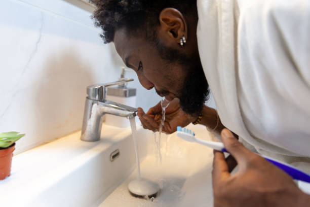 istock Afro men is cleaning mouth 1821265394