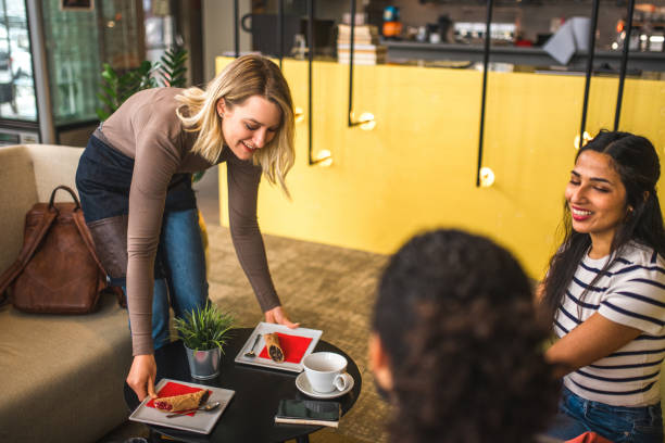 istock Cheerful Caucasian Waitress Placing An Order On A Table 1821265924