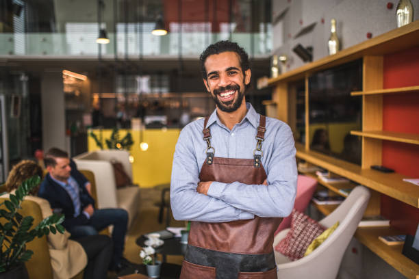 istock Cheerful Middle Easter Waiter With Arms Crossed In A Coffee House 1821276231