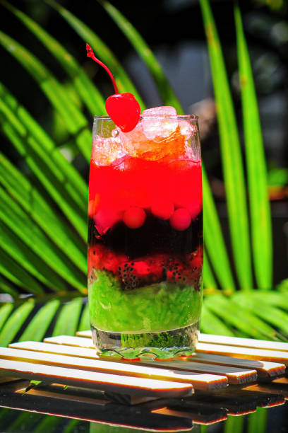 istock ice mixed with fruit filled with sticky rice tapai with a coconut leaf background 1821321745