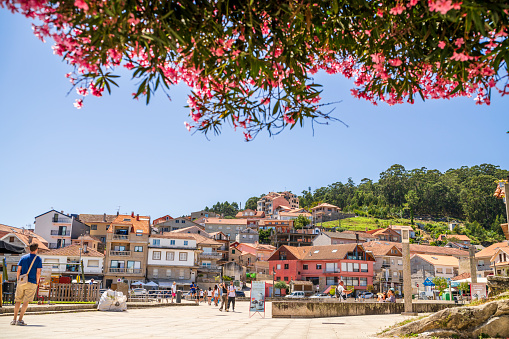 Combarro, Galicia / Spain - July 26 2023, Beautiful old village with pink flowers