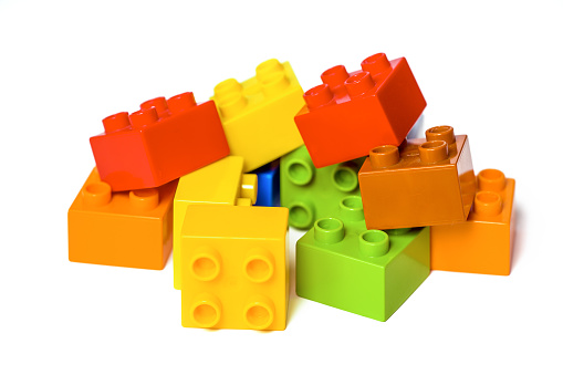Pile of Colorful Construction Blocks on white. Educational toy for children.