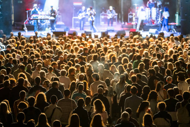 Wide shot of modern jazz band consisting of four members performing on stage in local bar
