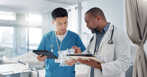 Internet, black man or doctor with a tablet, typing or connection with online results, healthcare or website information. African person, worker or medical professional with tech, surgeon or research
