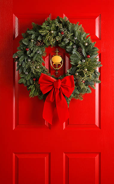istock Christmas Wreath on Red Door 182145239