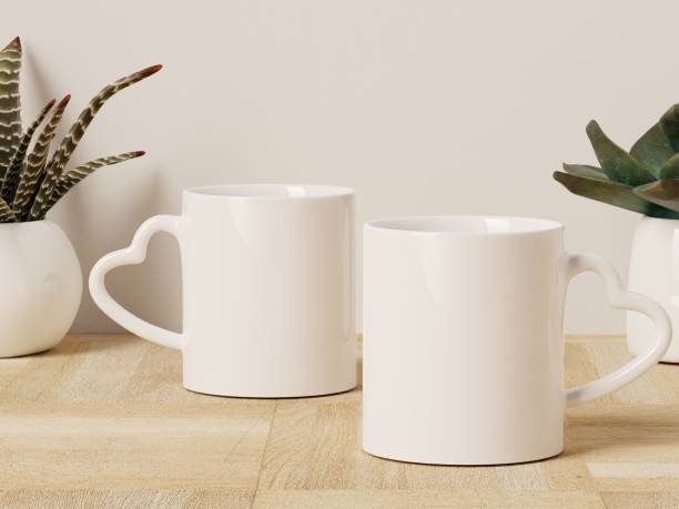 istock Three Heart Shaped Handle Mugs on a Wooden Floor with Succulent Plants in the Background 1821452992