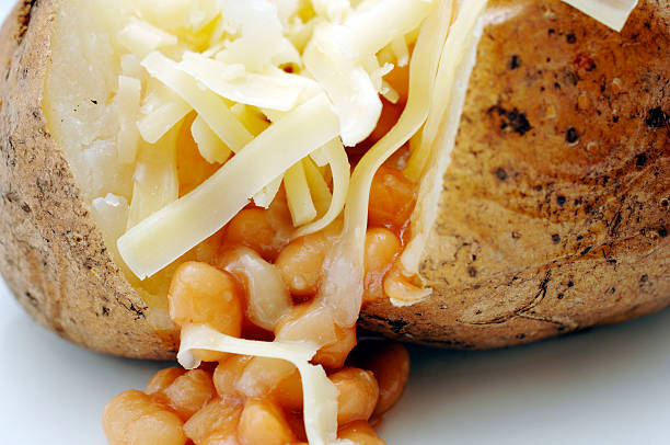 istock jacket potato, grated cheddar cheese & baked Beans 182145357