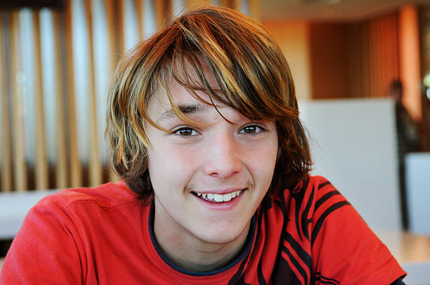 A teenage boy smiling at the camera.