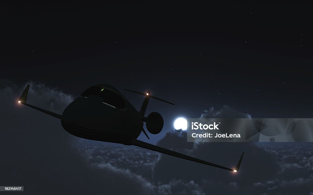 Night Flight Corporate jet flying above the clouds at night. Corporate Jet Stock Photo