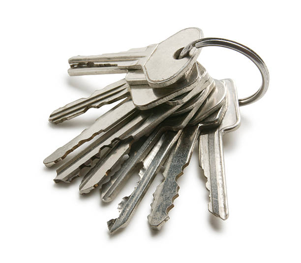 Keys on a key ring on white background Large set of keys on key ring. key ring photos stock pictures, royalty-free photos & images
