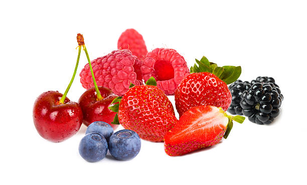 assortment of fresh berries on a white plate. useful vitamin healthy food fruit. healthy vegetable breakfast