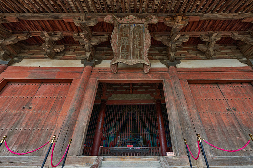 Luoyang,China -MAR 19: Visitors at Longmen grottoes on March 19, 2014.It is one of the four notable grottoes in Luoyang,Henan,China . A UNESCO World Heritage Site.