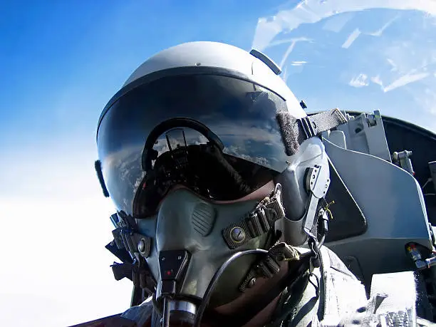 A fighter Pilot's self portrait ..ahem, thats me. Zoom into the visor, and see the cockpit and the hand taking the shot.