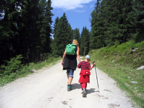 Mother and son walking uphill in the mountainssimilar images :