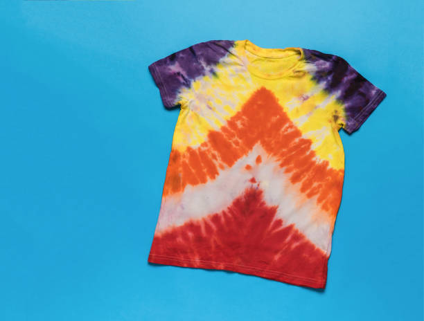 istock T-shirt with an arrow pattern in tie dye style on a blue background. 1821458218