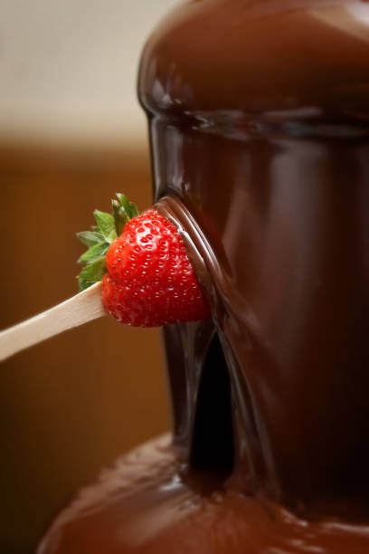 istock Strawberry in Chocolate Fountain 1 182145905