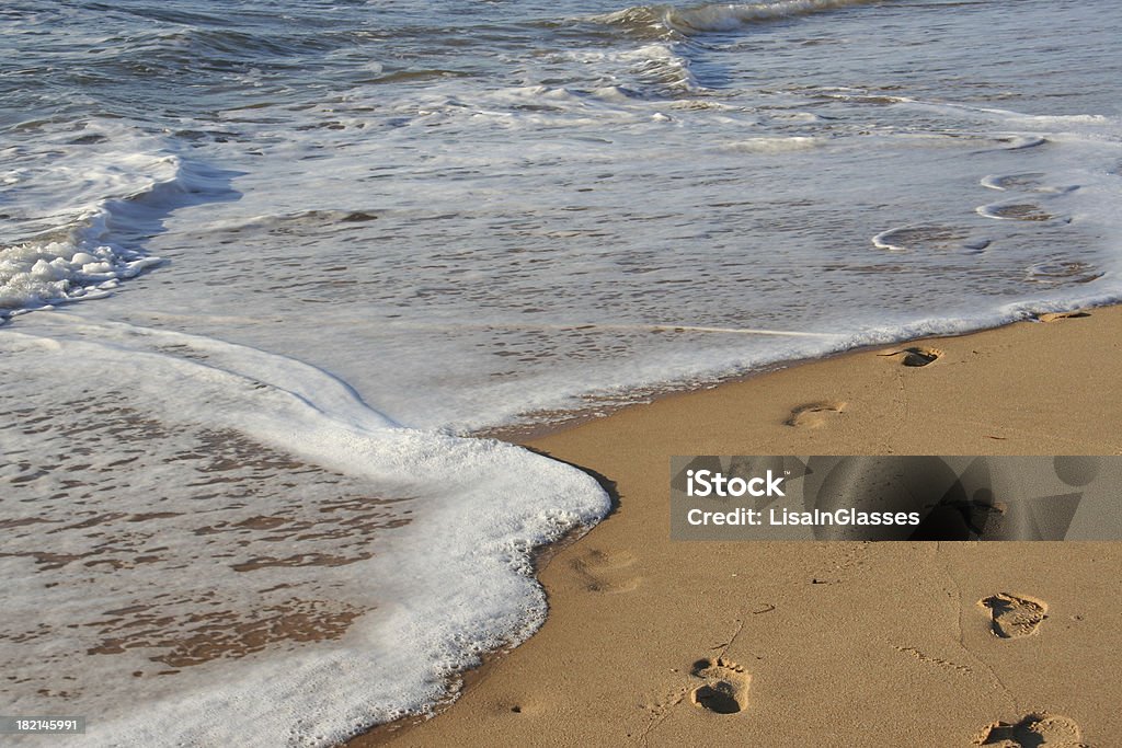 Footprints na Areia - Royalty-free Lavar Foto de stock