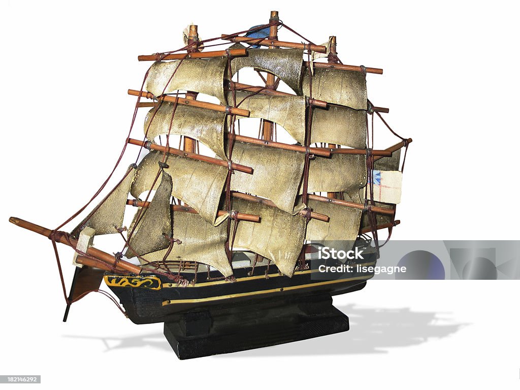 antique model pirate ship An antique model pirate ship isolated on a white background. Antique Stock Photo