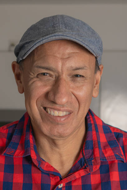 istock Senior handsome man wearing beret smiling in kitchen. 1821467938