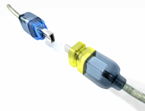 Two computer cables about to be plugged together. Loosely based on the translucent cables that come with new Macs. High quality rendering (global illumination).