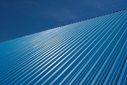 Blue metal roof on an industrial building.