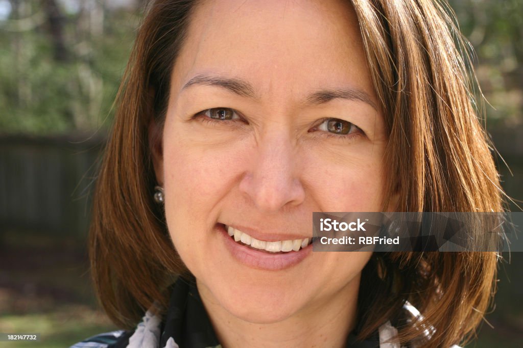 Asian woman smiling a smiling asian woman 35-39 Years Stock Photo