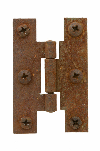 Rusted hinge with screws isolated on white.