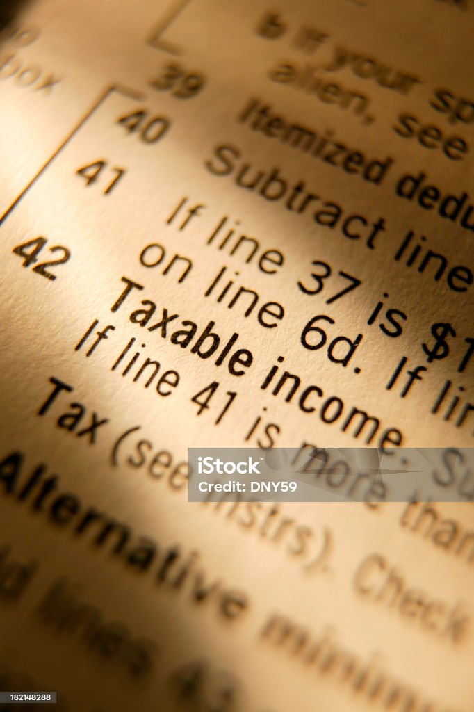 Tax Form 2 Close up showing various line items on IRS Form 1040. Shot with warm tungsten lighting 1040 Tax Form Stock Photo