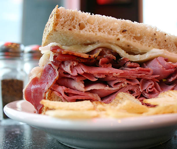 Deli Sandwich 2 A corned beef and pastrami sandwich on rye bread. pastrami photos stock pictures, royalty-free photos & images