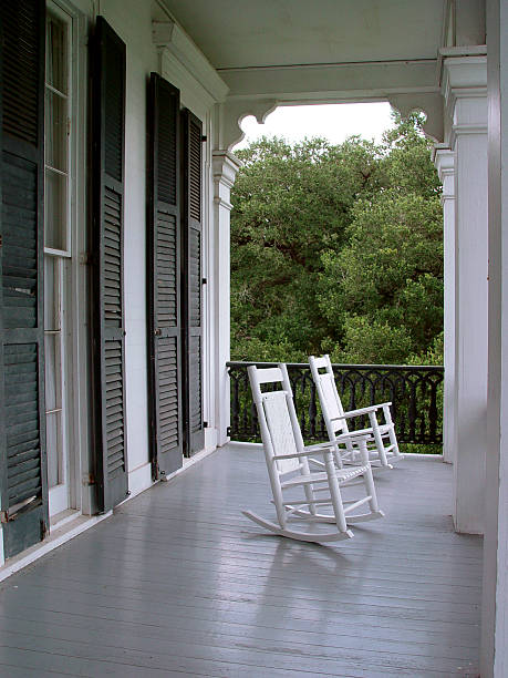 Two rocking chairs on a plantation house pourch in Louisiana.