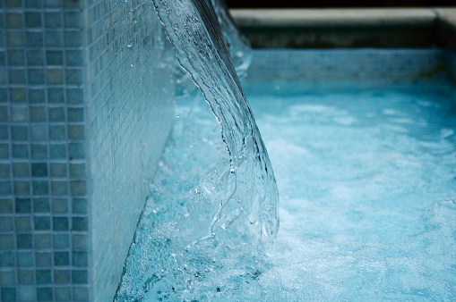 blue water from a tiled fountain