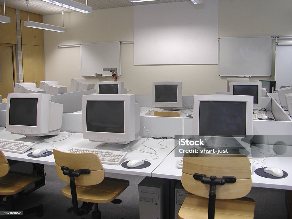 computer teaching room 1 modern computers in a friendly looking room for good learning Assistance Stock Photo