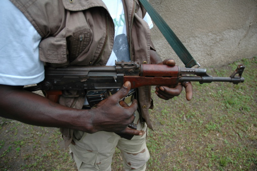 African Rebel and his ak-47...standing guard.