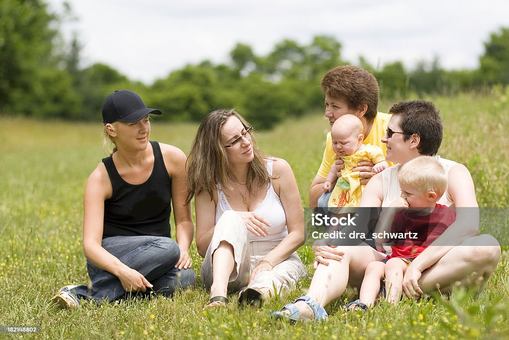 Girls talk Women together with kids on a Summer day Community Stock Photo