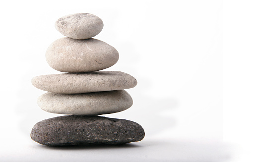 Close-up view of balanced stones on the beach