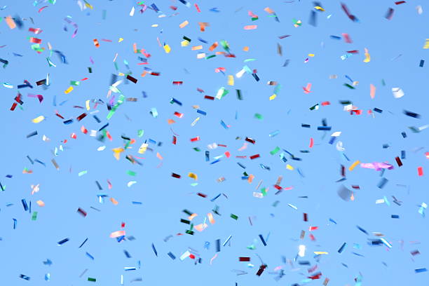 Confetti Celebration Multicoloured confetti against a bright blue sky - celebration time!See similar: confetti photos stock pictures, royalty-free photos & images