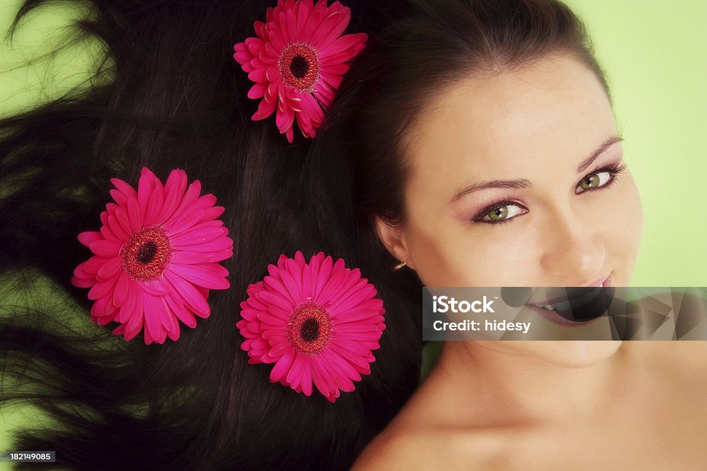 Gorgeous Hair Woman with Gerbra's in her hair 16-17 Years Stock Photo