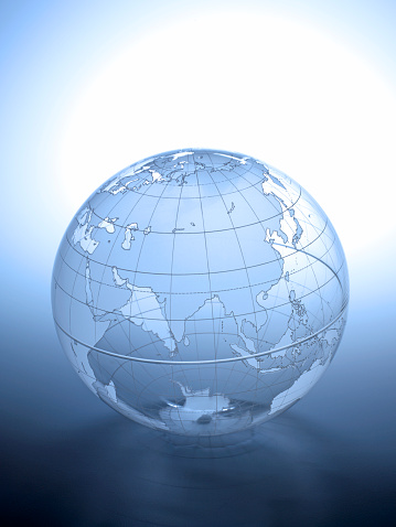 A transparent globe rotated to show India and Asia on a simple gradated background.  A blue color scheme dominates the image.