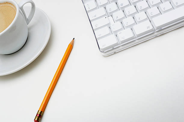 Business Office scenario, keyboard, pencil and coffee on work surface