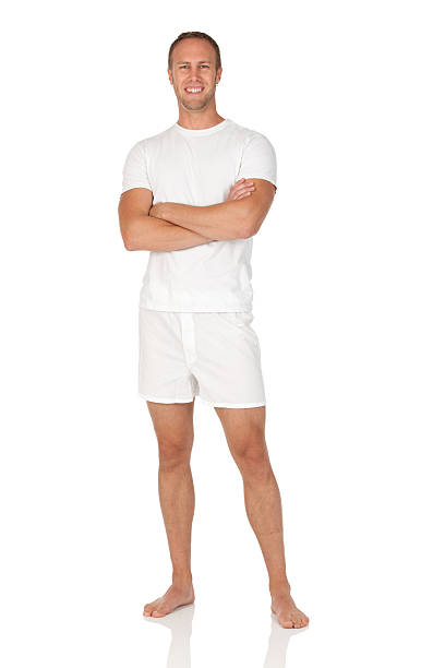 heureux homme debout avec les bras croisés - underwear men t shirt white photos et images de collection