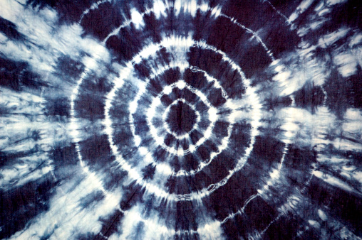 Indigo tie dye fabric in groovy circular pattern.  Self-made pattern on fabric.