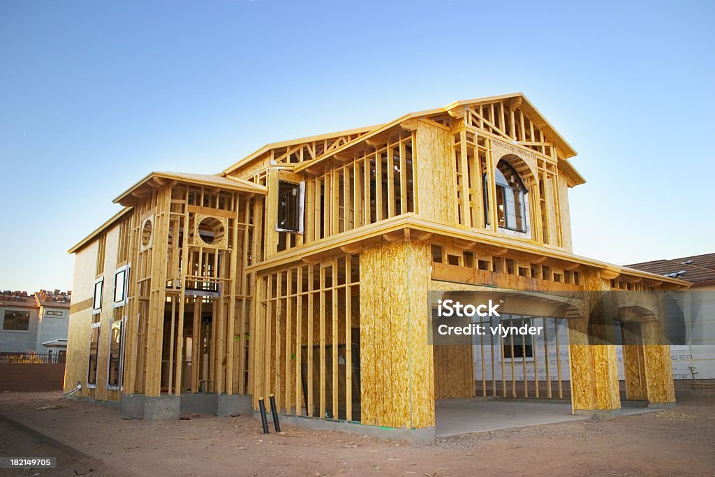 Framed house under construction A house in the framing stages. Construction Industry Stock Photo